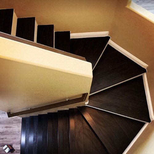 brown hardwood stairs provided and installed by Budget Flooring & Shutters in Las Vegas, NV